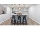 Well-lit kitchen with a kitchen island, hardwood floors, and modern finishes creating a bright and inviting atmosphere at 640 Saddle Ridge Trce, Roswell, GA 30076