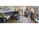 Well-lit living room with hardwood floors, a large sofa, and easy access to the kitchen at 640 Saddle Ridge Trce, Roswell, GA 30076