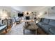 Cozy living room with a fireplace, built-in shelving, and comfortable seating at 640 Saddle Ridge Trce, Roswell, GA 30076