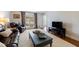 Inviting living room with plush seating, a large window, and a spacious layout at 640 Saddle Ridge Trce, Roswell, GA 30076