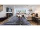 Spacious living room with a fireplace, large sectional couch, and an accent rug for a warm, inviting space at 640 Saddle Ridge Trce, Roswell, GA 30076