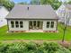 Spacious backyard with a covered patio, perfect for outdoor living and entertaining at 1019 Cooks Farm Way, Woodstock, GA 30189