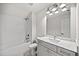 Bright bathroom with white subway tile, gray vanity, and modern fixtures at 1019 Cooks Farm Way, Woodstock, GA 30189