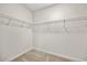 Walk in closet with custom shelving and lighting at 1019 Cooks Farm Way, Woodstock, GA 30189
