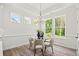 Bright dining room featuring modern lighting and a view of the backyard at 1019 Cooks Farm Way, Woodstock, GA 30189