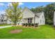 Well-maintained home with a manicured lawn, charming curb appeal, and an inviting front porch at 1019 Cooks Farm Way, Woodstock, GA 30189