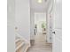 Hallway view with wood-look floors leading to a bright living area at 1019 Cooks Farm Way, Woodstock, GA 30189