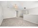 Large open living room with neutral carpet and stylish lighting fixture at 1019 Cooks Farm Way, Woodstock, GA 30189