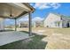 Spacious backyard with a covered patio area for outdoor enjoyment and backyard views at 3002 Blue Stone Ct, Dacula, GA 30019