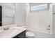 Clean bathroom featuring a white sink, toilet, and bathtub at 3002 Blue Stone Ct, Dacula, GA 30019