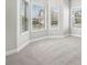Bright bedroom with neutral carpet and many windows bringing in plenty of sunlight at 3002 Blue Stone Ct, Dacula, GA 30019