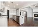 Bright kitchen with gray cabinets, granite countertops, and stainless steel appliances at 3002 Blue Stone Ct, Dacula, GA 30019