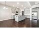 Modern kitchen with stainless steel appliances, granite countertops, and a center island at 3002 Blue Stone Ct, Dacula, GA 30019