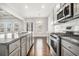 Bright kitchen with granite countertops, stainless steel appliances, and hardwood floors at 3002 Blue Stone Ct, Dacula, GA 30019