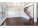 Elegant living room featuring hardwood floors, white wainscoting, and a chandelier at 3002 Blue Stone Ct, Dacula, GA 30019
