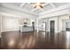Spacious living room featuring a fireplace, hardwood floors, and a view of the kitchen at 3002 Blue Stone Ct, Dacula, GA 30019
