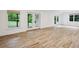 Finished basement with wood-look tile flooring and access to the backyard at 369 Pinecrest Ne Rd, Atlanta, GA 30342