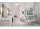 A bright bathroom features a soaking tub, and walk in shower with marble surround at 369 Pinecrest Ne Rd, Atlanta, GA 30342