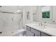This bathroom features a glass shower and white marble vanity with storage at 369 Pinecrest Ne Rd, Atlanta, GA 30342