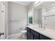 Bathroom featuring a white vanity with a gray countertop and tiled shower at 369 Pinecrest Ne Rd, Atlanta, GA 30342