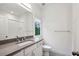 Modern bathroom featuring a gray granite vanity and a large mirror at 369 Pinecrest Ne Rd, Atlanta, GA 30342