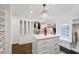 A well organized closet has a central island, custom cabinets and natural light at 369 Pinecrest Ne Rd, Atlanta, GA 30342
