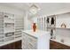 A stunning closet features custom shelving, an island and natural light at 369 Pinecrest Ne Rd, Atlanta, GA 30342