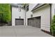View of attached three-car garage, complete with carriage doors at 369 Pinecrest Ne Rd, Atlanta, GA 30342