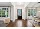 Bright foyer with herringbone floors, large windows, and stylish decor at 369 Pinecrest Ne Rd, Atlanta, GA 30342