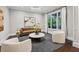 Comfortable sitting room featuring large window, stylish decor, and neutral tones at 369 Pinecrest Ne Rd, Atlanta, GA 30342