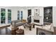 Living room with fireplace, built-in shelving, and access to the porch at 369 Pinecrest Ne Rd, Atlanta, GA 30342