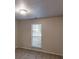 Neutral bedroom featuring window with blinds, ideal for relaxation and personal space at 3979 Sharon Spgs, Powder Springs, GA 30127