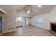 Bright and open living space with hardwood floors, a fireplace, and a view into the adjoining kitchen at 3979 Sharon Spgs, Powder Springs, GA 30127