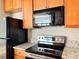 Updated kitchen featuring wood cabinets, microwave, and oven at 502 Pryor St # 207, Atlanta, GA 30312
