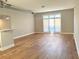 Open living space with wood floors and a sliding glass door at 502 Pryor St # 207, Atlanta, GA 30312