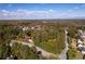 Aerial view featuring the home and surrounding trees highlighting community's natural beauty at 5098 Meadows Rd, Powder Springs, GA 30127