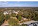 An aerial view showcases the property in a leafy neighborhood, dotted with a variety of homes and trees at 5098 Meadows Rd, Powder Springs, GA 30127