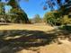 Spacious backyard featuring a large grassy area and mature trees, perfect for outdoor activities at 5098 Meadows Rd, Powder Springs, GA 30127
