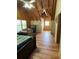 Second view of bright bedroom with wood ceiling, laminated floor, and natural light at 5098 Meadows Rd, Powder Springs, GA 30127