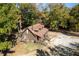 Exterior showcasing a well-maintained wooden home with a lovely yard and inviting curb appeal at 5098 Meadows Rd, Powder Springs, GA 30127