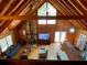 A spacious living room with wood ceilings and a comfortable blue sofa at 5098 Meadows Rd, Powder Springs, GA 30127