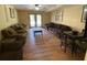 Spacious living room with laminate floors, modern furniture and glass doors at 5098 Meadows Rd, Powder Springs, GA 30127