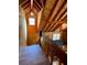 Interior view of the living room overlooking the wooden stairway and kitchen at 5098 Meadows Rd, Powder Springs, GA 30127