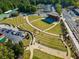 Aerial view of amphitheater with terraced seating, a stage, and surrounding greenery providing a recreational venue at 815 Paden St, Woodstock, GA 30188