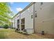 Exterior view of home from backyard with two patios, lawn and landscaping at 815 Paden St, Woodstock, GA 30188