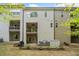 Exterior view of home from backyard with two patios, lawn and landscaping at 815 Paden St, Woodstock, GA 30188