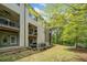 Exterior view of home from backyard with two patios, lawn and landscaping at 815 Paden St, Woodstock, GA 30188