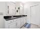 Double sink bathroom with granite counters, ample storage, and two mirrors at 815 Paden St, Woodstock, GA 30188