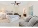Spacious bedroom with a ceiling fan, ensuite bathroom and lots of natural light at 815 Paden St, Woodstock, GA 30188