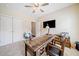 Bedroom featuring neutral carpet, rustic desk, modern ceiling fan, and light walls at 815 Paden St, Woodstock, GA 30188